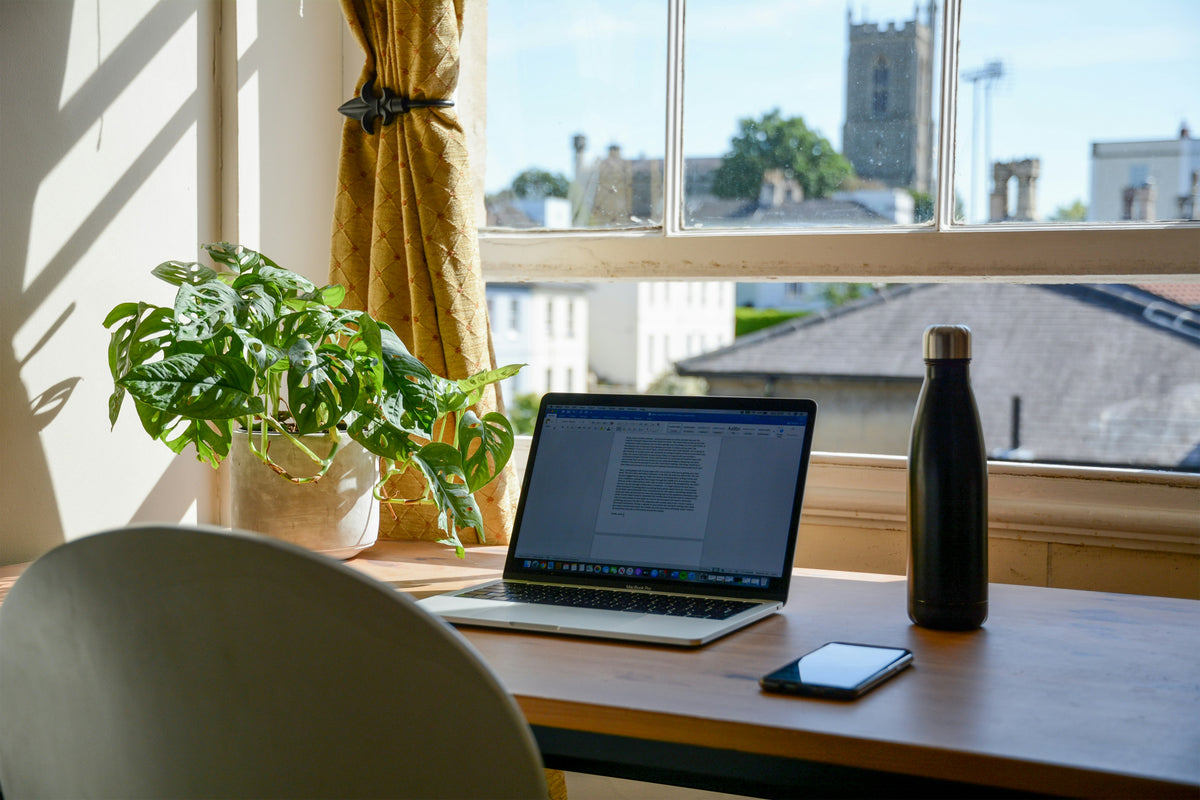 Laptop and mobile devices in a home workspace